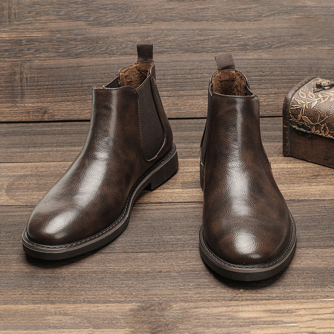 Pair of Men's Classic Slip-On Chelsea Boots in rich burgundy, showing smooth leather texture