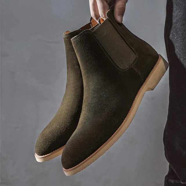 Classic men's slip-on Chelsea boots with elastic side panels for a snug fit.