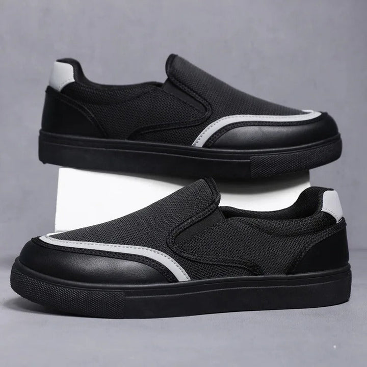Comfortable men's deck shoes in a classic slip-on design, ideal for all-day wear.