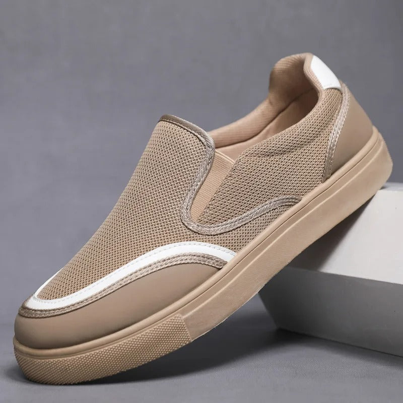 Close-up of the textured upper on men's slip-on loafers, emphasizing material & craftsmanship.