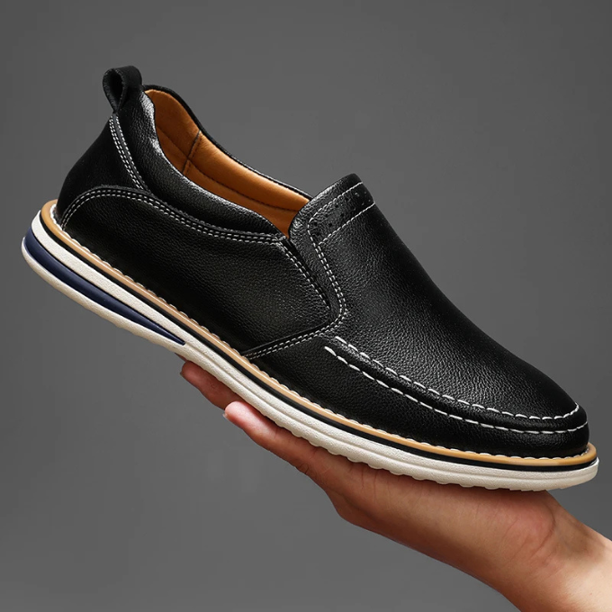 Studio shot of men's everyday leather loafers, highlighting the clean and versatile design.