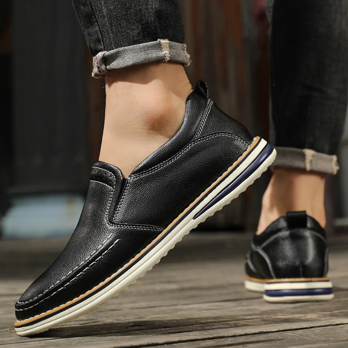 Classic men's leather moc-toe loafers, presented as essential slip-on footwear for casual dress.