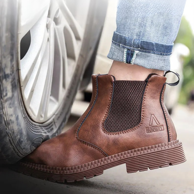 Men's slip-resistant Chelsea work boots, showcasing the robust sole for workplace safety