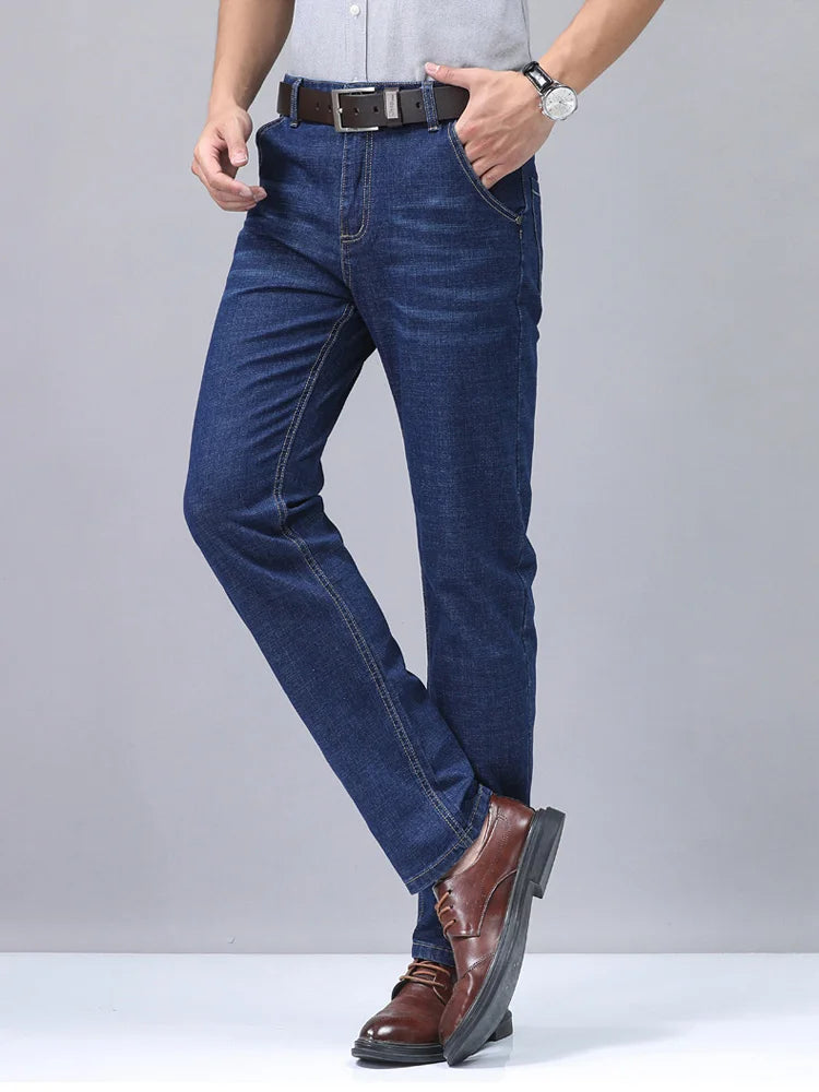 Close-up of the textured premium cotton fabric on men's straight fit blue denim jeans.