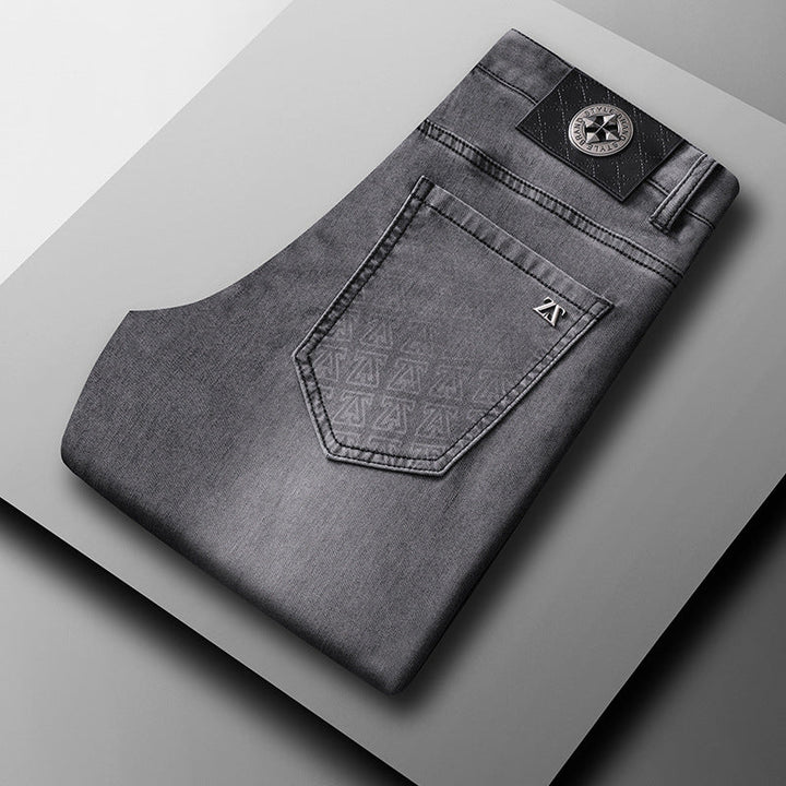 Men's classic straight-fit stretch denim jeans in a medium wash, ideal for versatile casual wear.