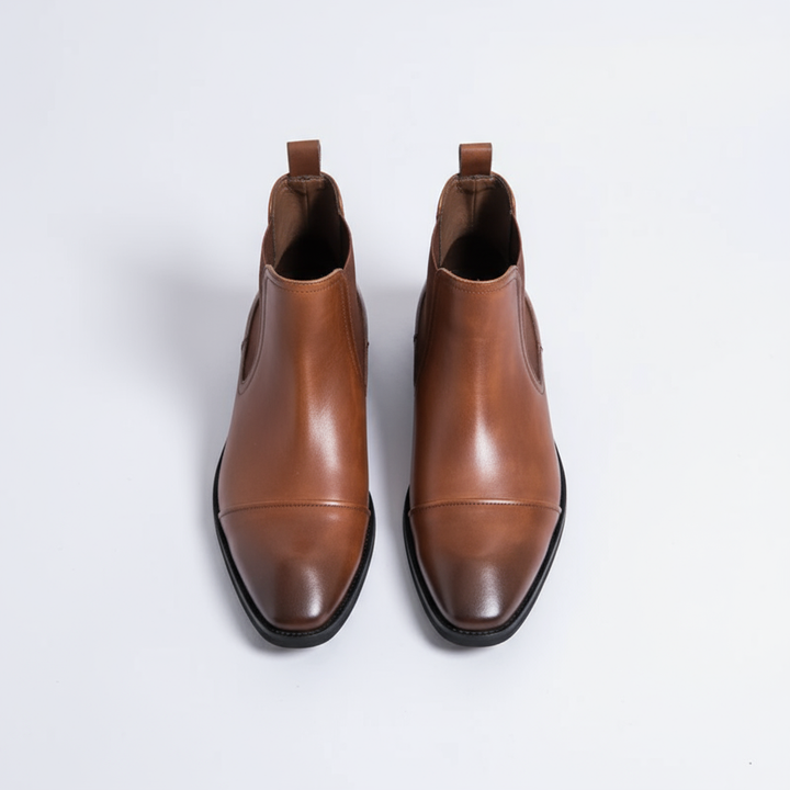 Men's stylish dark blue full grain leather Chelsea boots, a modern twist on a classic men's footwear style.