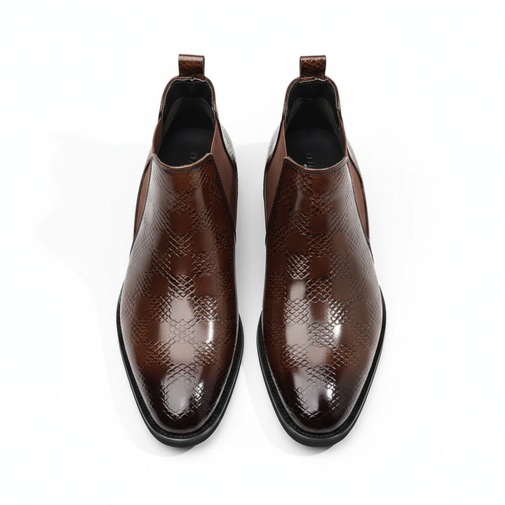 Men's leather ankle boots in a traditional Chelsea design, offering easy slip-on convenience.