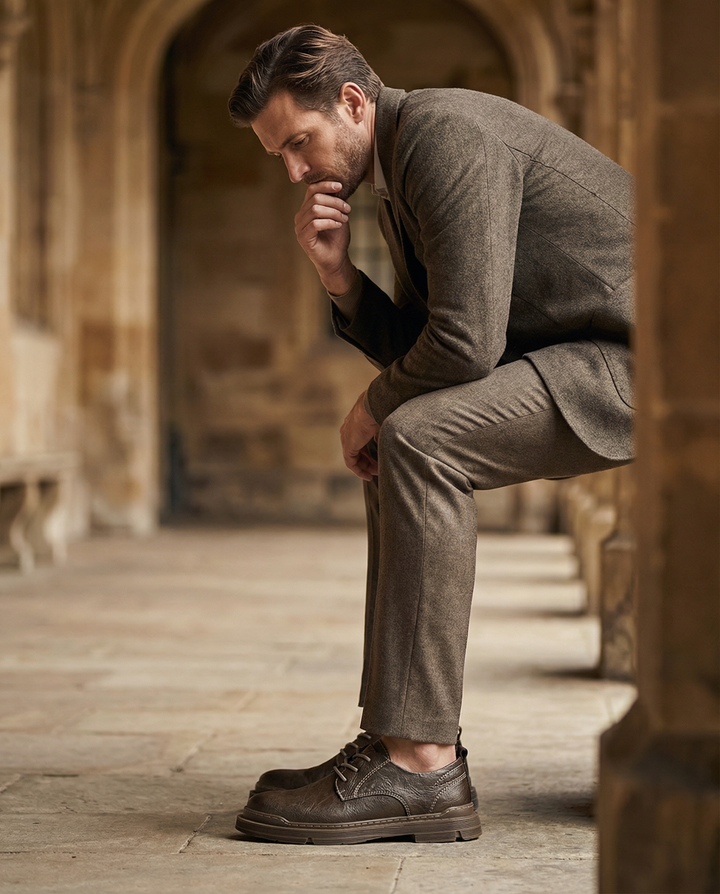 Front view of men's stylish black leather derby shoes, great for business or casual attire