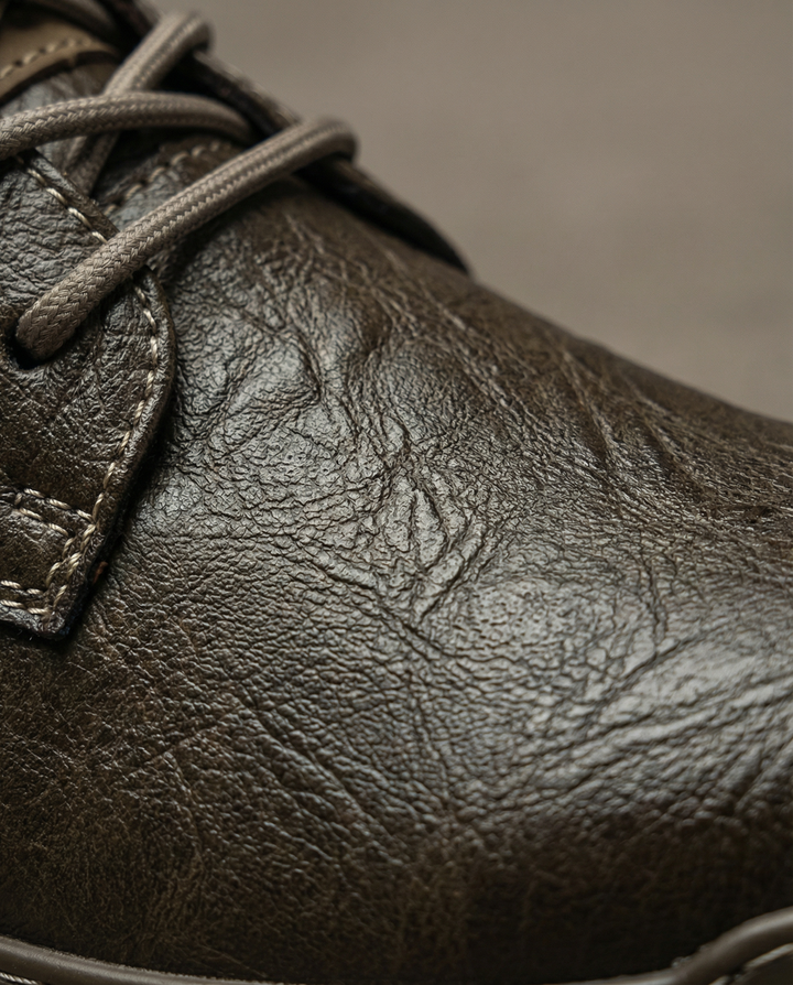 Detailed shot of men's vintage-style brown leather derby shoes, with fine lacing