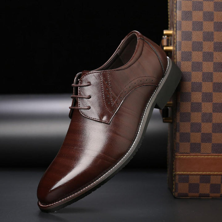Men's classic tan leather lace-up oxford dress shoes, perfect for formal business attire.