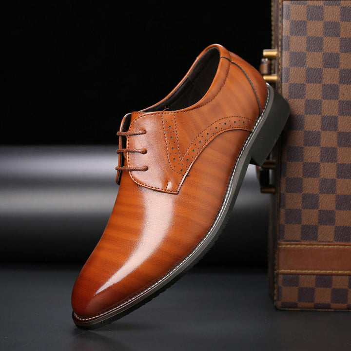 Classic men's brown leather lace-up oxford shoes for formal events, a timeless footwear choice.