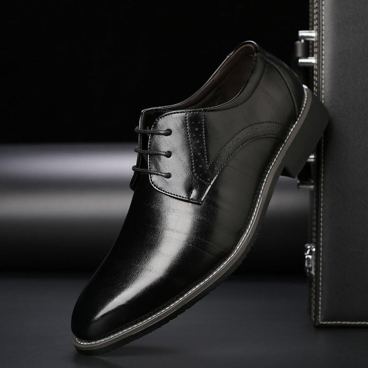 Men's classic lace-up dress shoes with a polished finish, essential formal footwear for men.