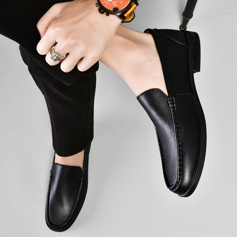 Close-up of a men's brown leather loafer, showcasing the quality craftsmanship and stitching.