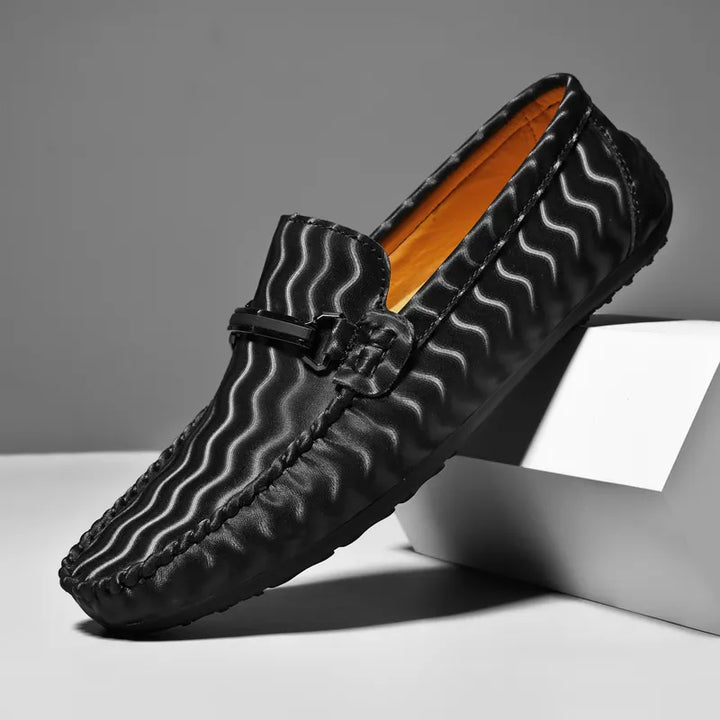 Stylish men's brown leather loafers, perfect versatile footwear for both casual and formal occasions.