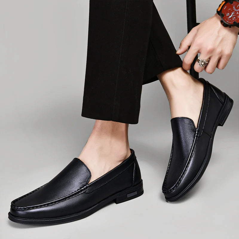 Stylish men's classic leather loafers in a dark brown hue, ideal men's footwear for versatile outfits.