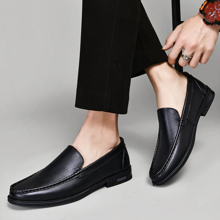 Stylish men's classic leather loafers in a dark brown hue, ideal men's footwear for versatile outfits.