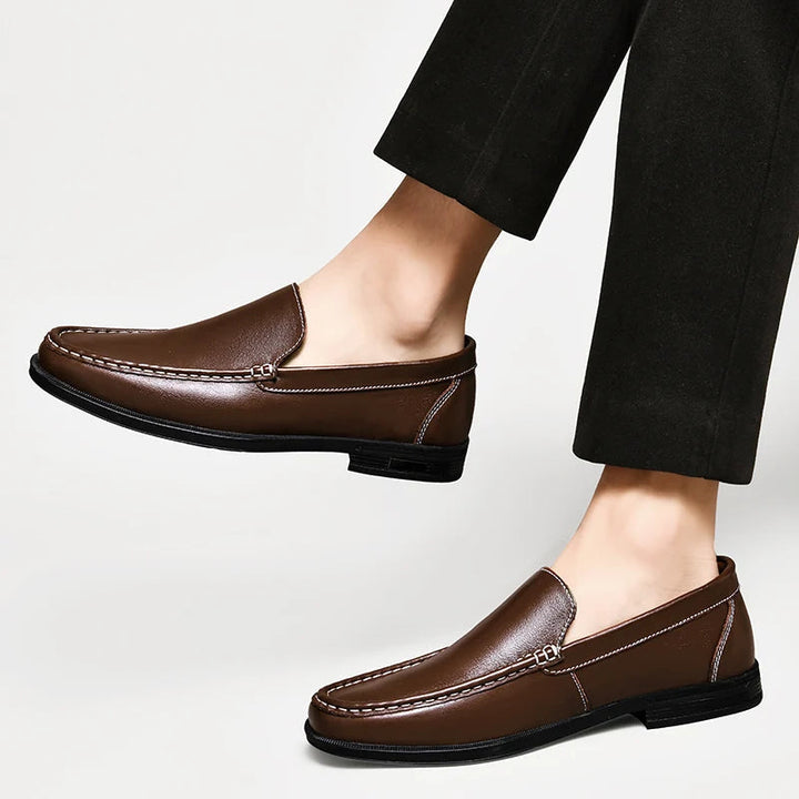Front view of men's sleek leather loafers, a staple in classic men's shoe collections.