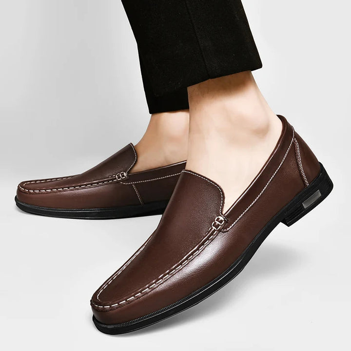 Detailed shot of the sole of a men's leather loafer, highlighting durability and non-slip design.
