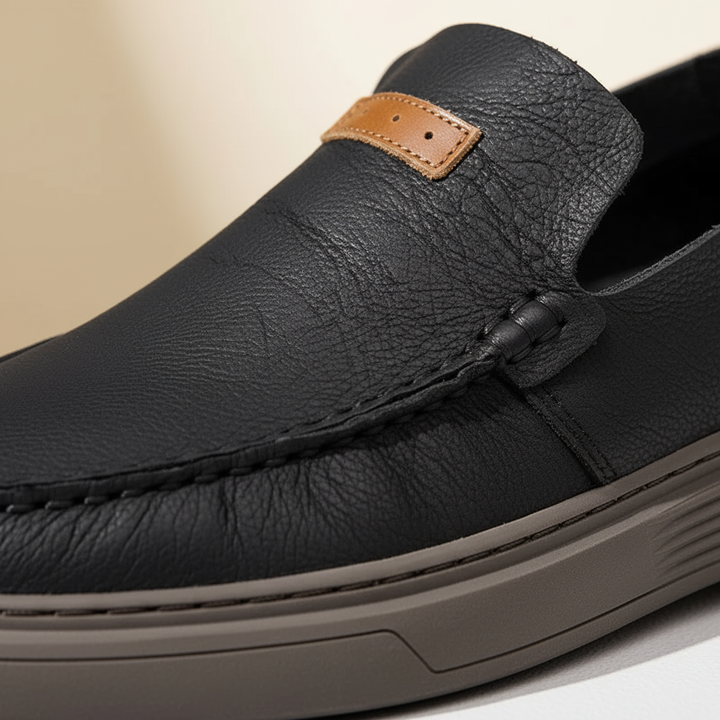 Men's comfortable gray leather slip-on loafers, perfect for relaxed yet stylish casual outfits