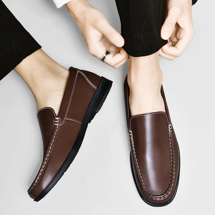 Men's leather loafers displayed in a retail setting, emphasizing their timeless appeal and comfort.