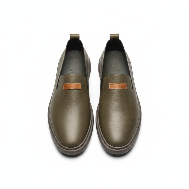 Model wearing men's classic leather loafers with chino pants, demonstrating comfortable style