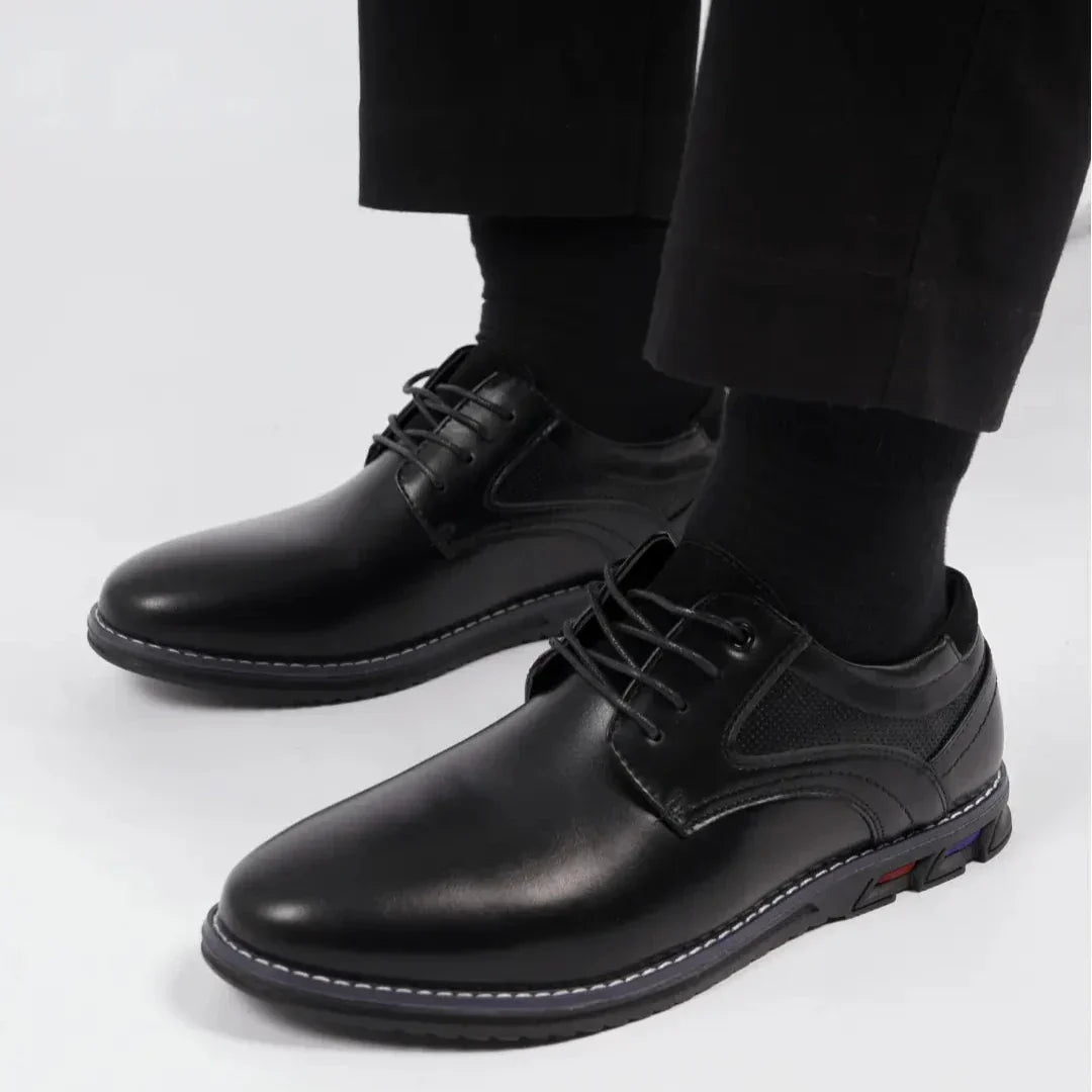 Side view of men's classic leather oxford shoes in a rich burgundy, highlighting the quality craftsmanship.