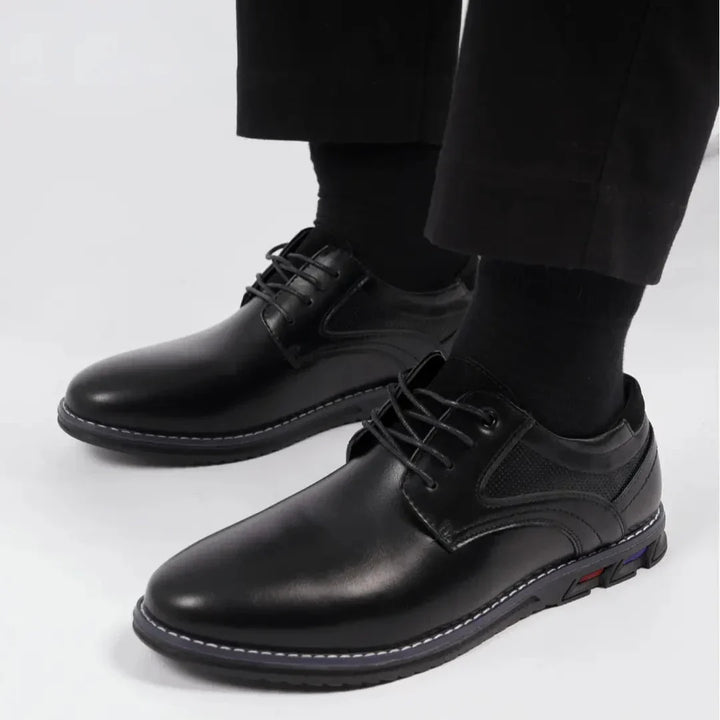 Side view of men's classic leather oxford shoes in a rich burgundy, highlighting the quality craftsmanship.