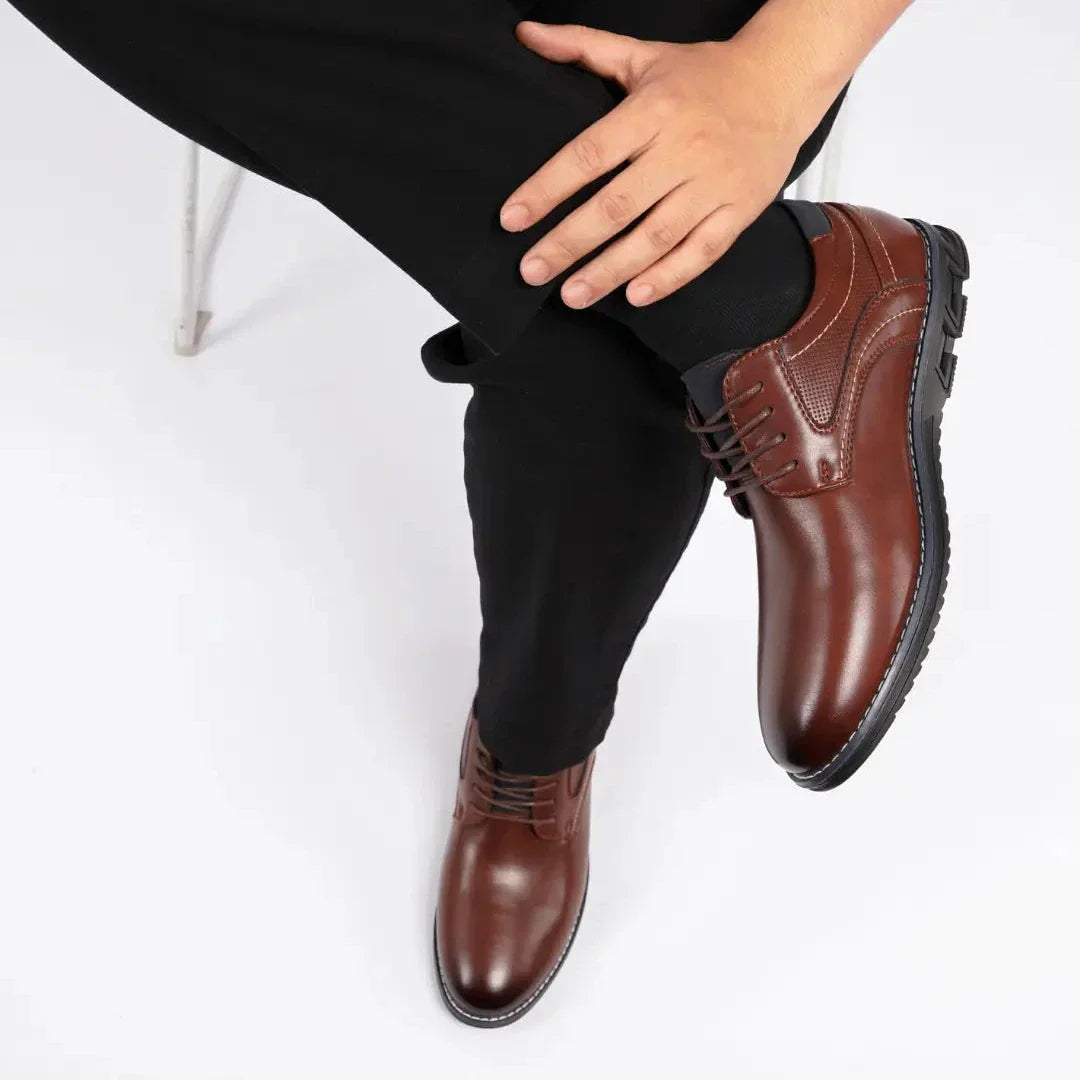 Top view of elegant men's black leather dress shoes, emphasizing the clean lines and timeless style.