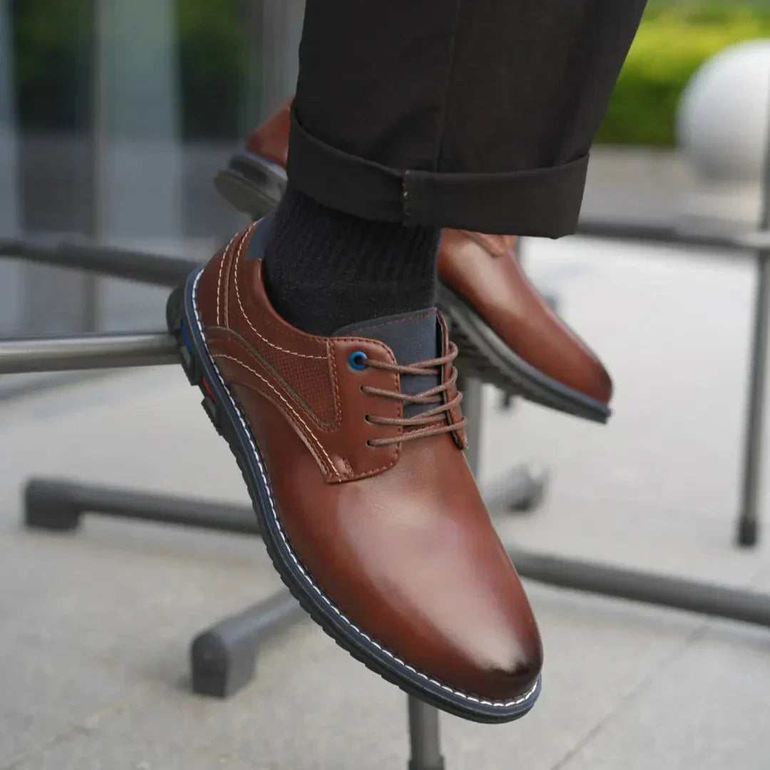 Men's leather dress shoes in a classic brown hue, featuring a comfortable sole for all-day wear.
