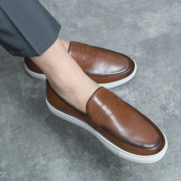 Underside of men's leather loafers, showing the durable non-slip sole for traction.