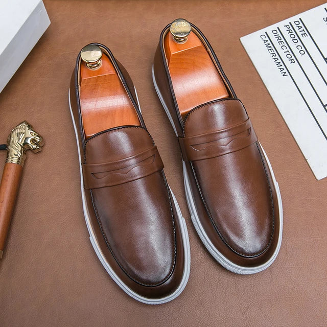 Front view of men's polished black leather loafers, ready for any dress-up occasion.