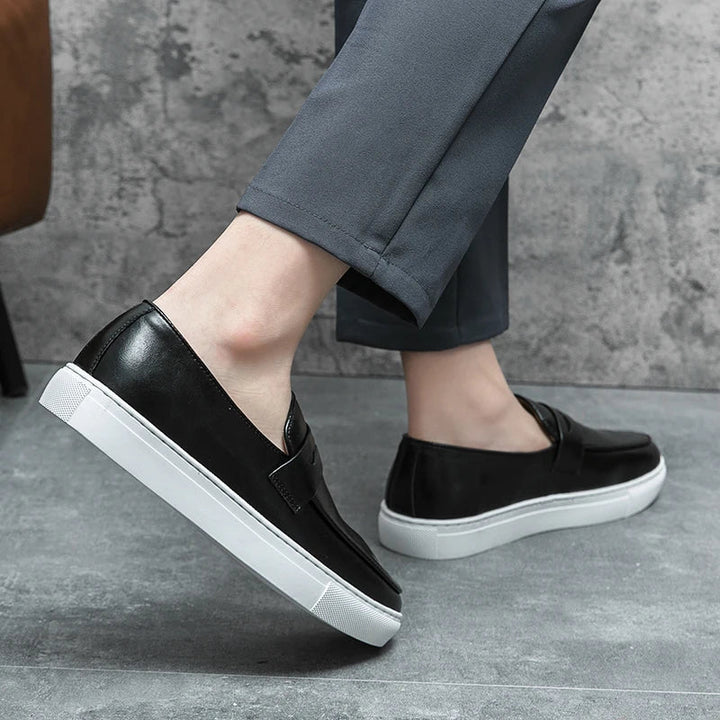 Close-up of the stitching on men's genuine leather slip-on loafers, highlighting craftsmanship.
