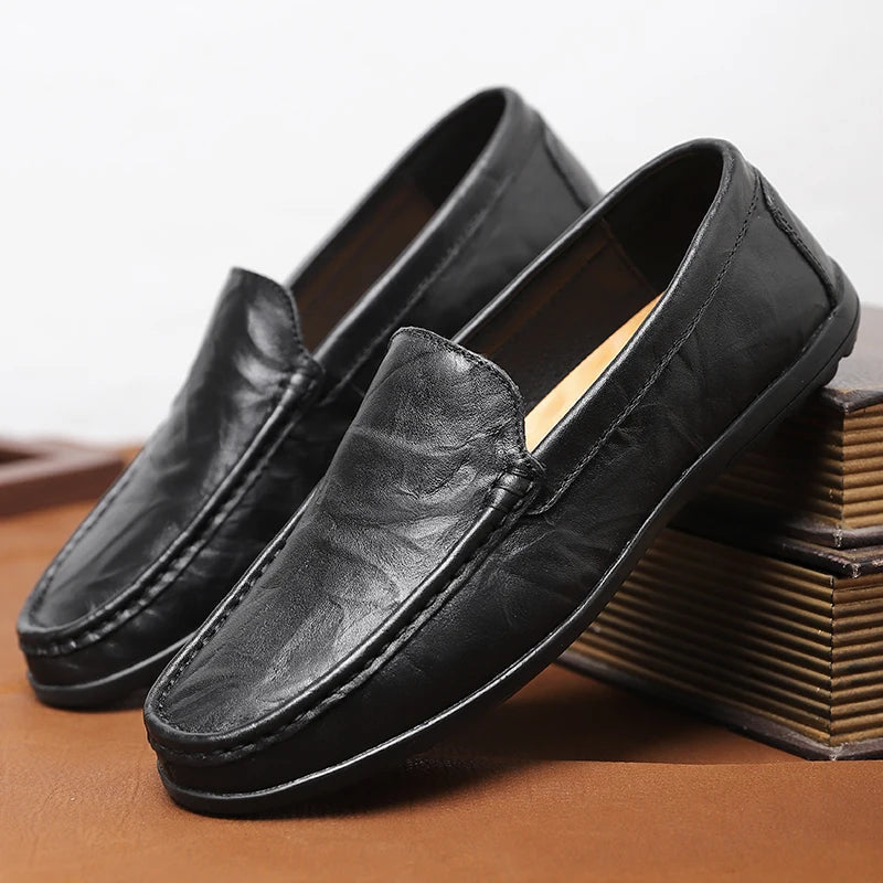 Men's classic tan leather slip-on loafers, ideal for business casual or everyday wear.