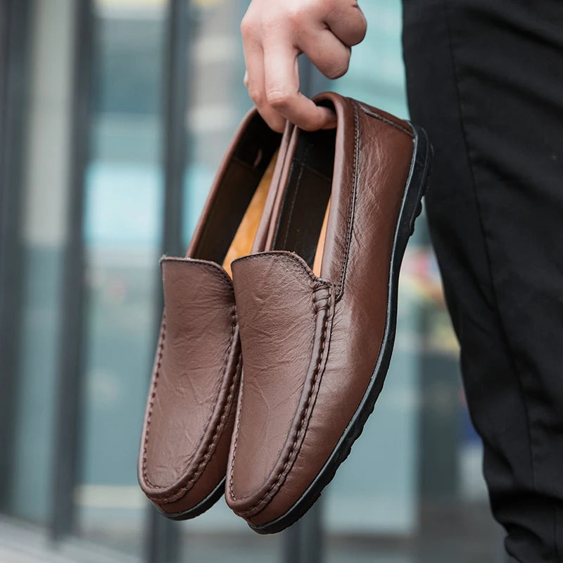 Men's dress-casual leather slip-on loafers, combining traditional design with modern comfort.