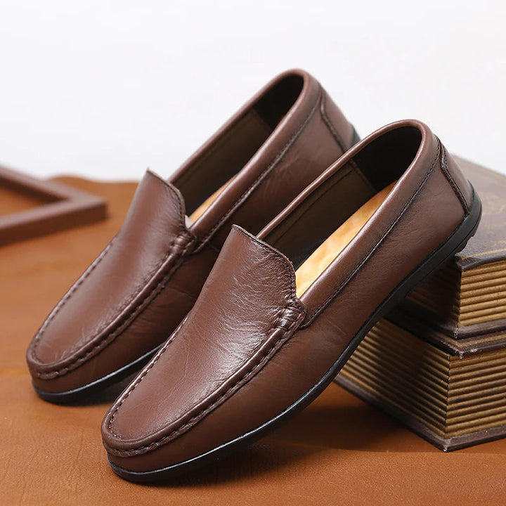 Men's timeless slip-on leather loafers in various colors, perfect for a sophisticated casual look.