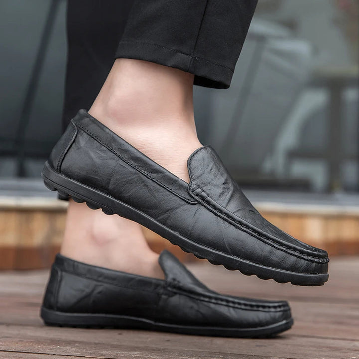 Men's comfortable leather slip-on loafers in a rich burgundy hue, enhancing casual wear.