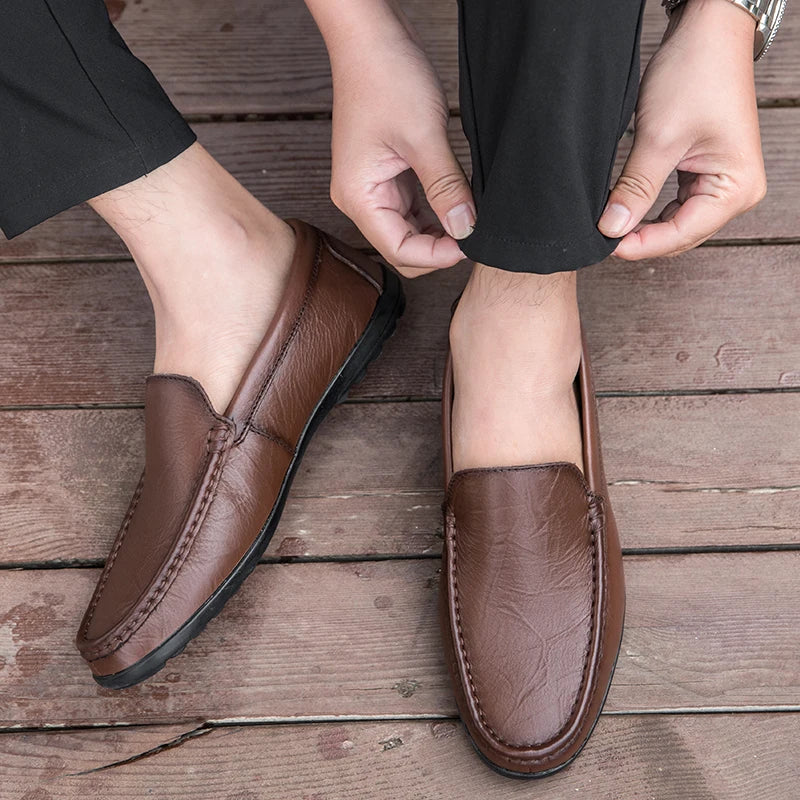 Side view of men's durable leather slip-on loafers, showcasing the classic design and quality.