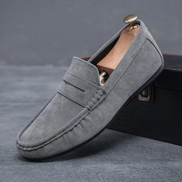 Men's classic tan slip-on loafers, elegant and comfortable casual footwear.