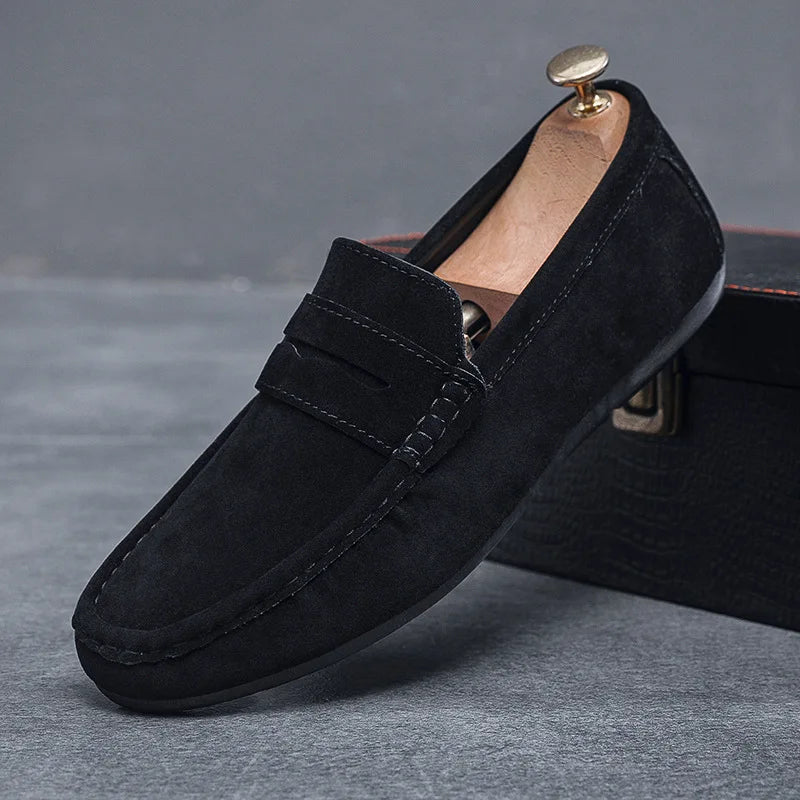 Brown leather men's slip-on loafers, perfect for formal or everyday wear.
