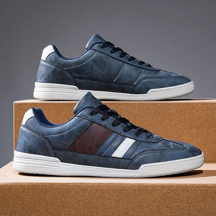Close-up of brown men's casual sneakers, highlighting distressed details and comfortable design.