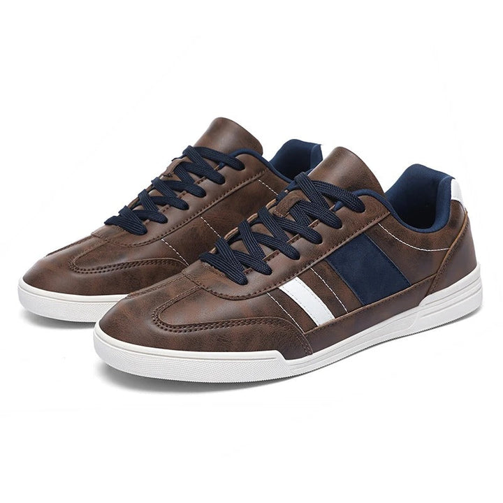 Pair of blue men's classic sneakers, durable and comfortable urban footwear for casual wear.