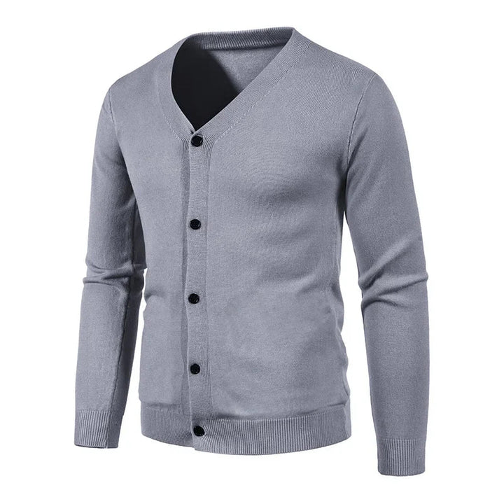 Man modeling a comfortable men's V-neck knit sweater, a key piece for winter fashion.
