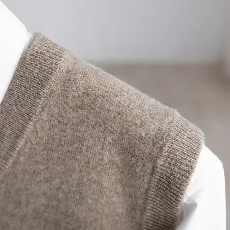Men's soft V-neck sweater vest, lightweight & classic; a versatile choice for smart business casual layering.