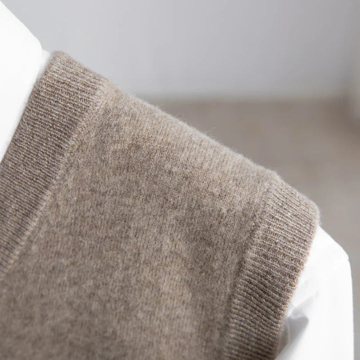 Men's soft V-neck sweater vest, lightweight & classic; a versatile choice for smart business casual layering.