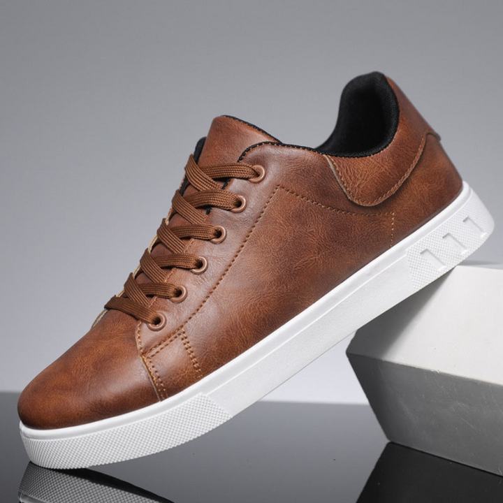Men's classic white lace-up low top sneakers for versatile everyday casual wear.