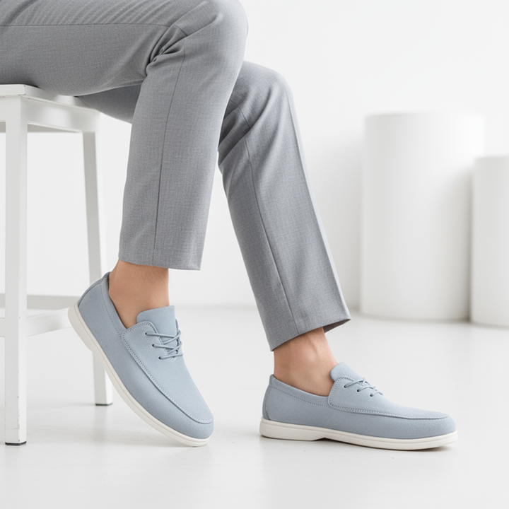 Stylized shot of Men's Cloud Comfort Suede Loafers on a clean background