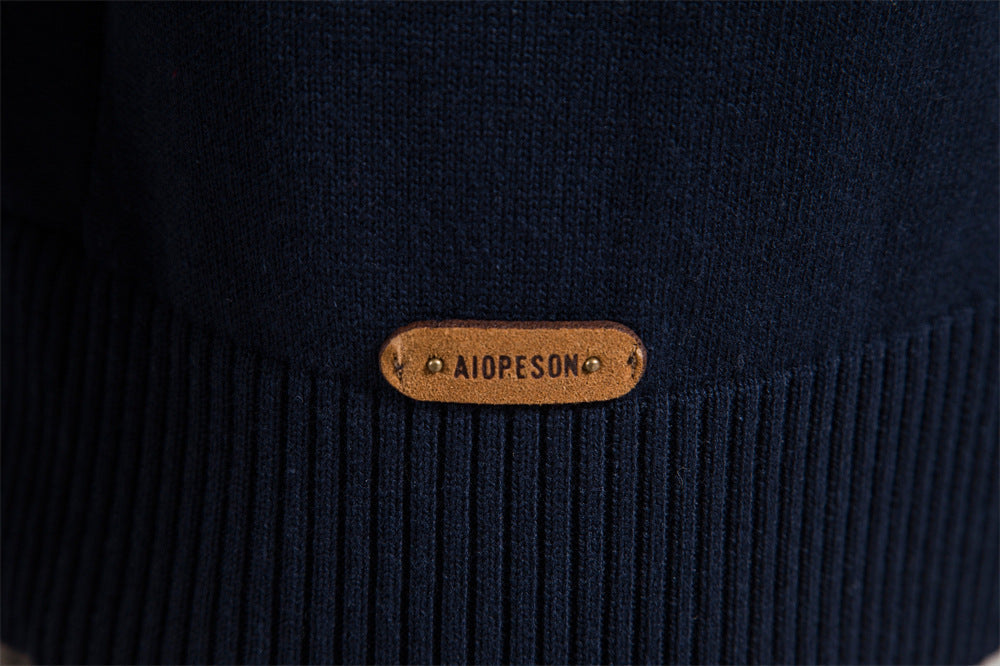 On-model shot of men's colorblock half-zip sweater, demonstrating its excellent drape