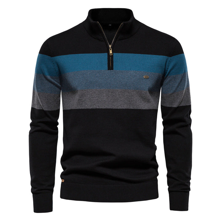 Close-up of the cotton blend fabric on a men's colorblock half-zip pullover, soft texture