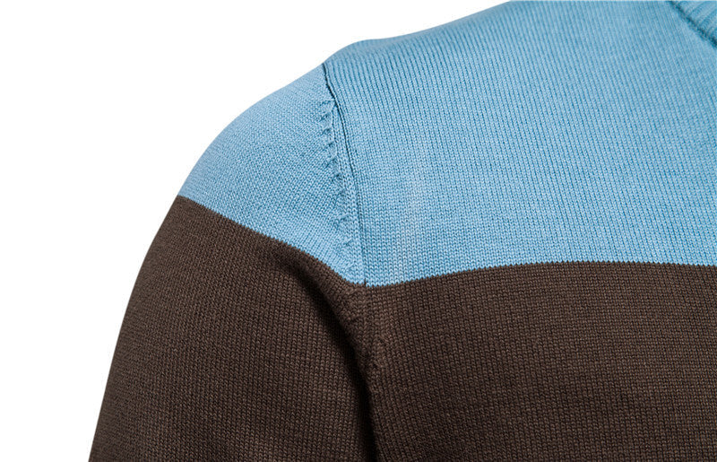 Outdoor shot of a man wearing a practical colorblock zip-up cardigan, long sleeve, activewear.