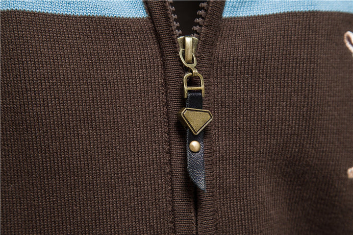 Folded men's colorblock knit zip-up cardigan sweater, showcasing its soft lightweight material.